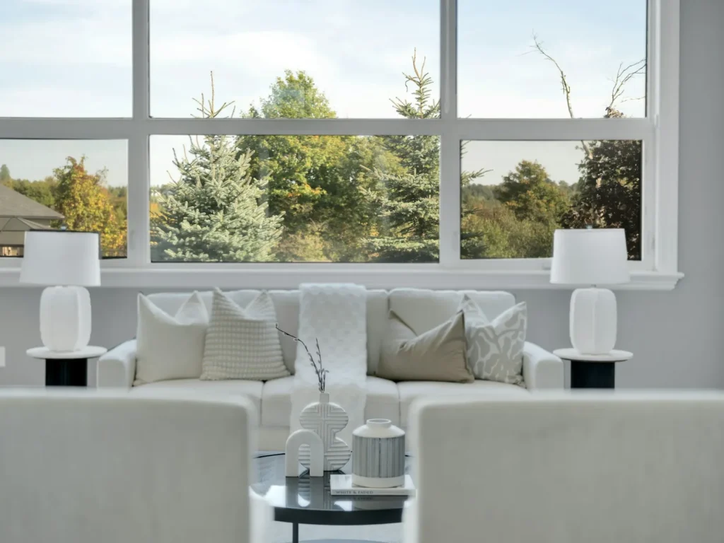 Home interior with high windows above the living area