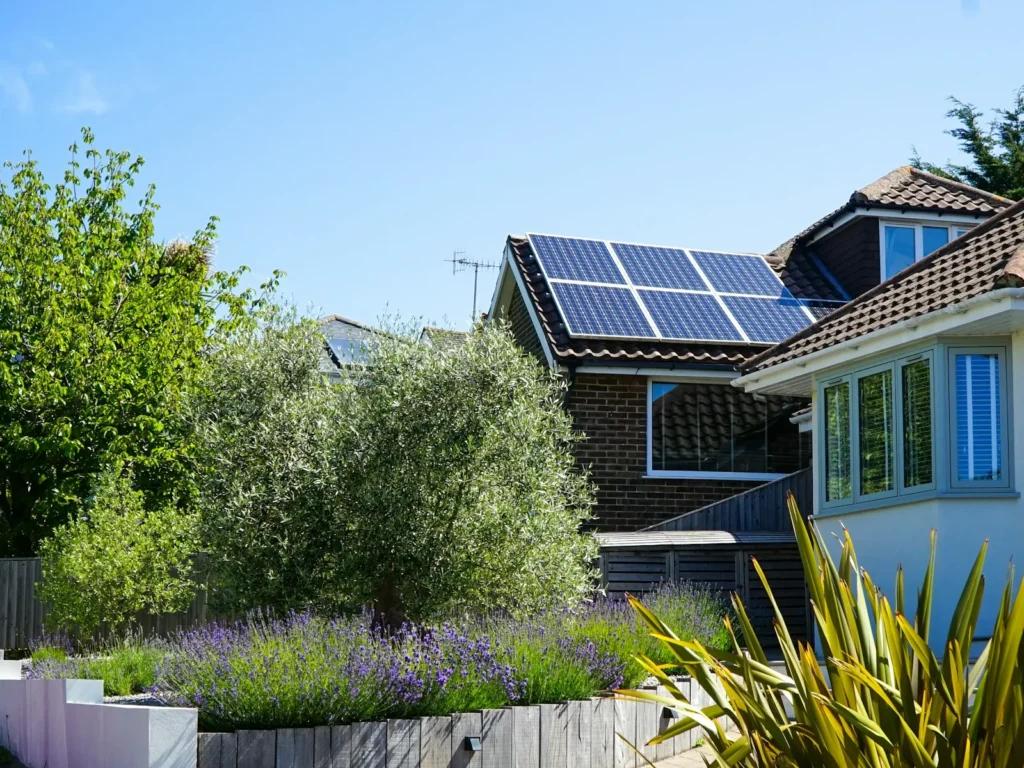 Southern California home with rooftop solar panels and palm trees